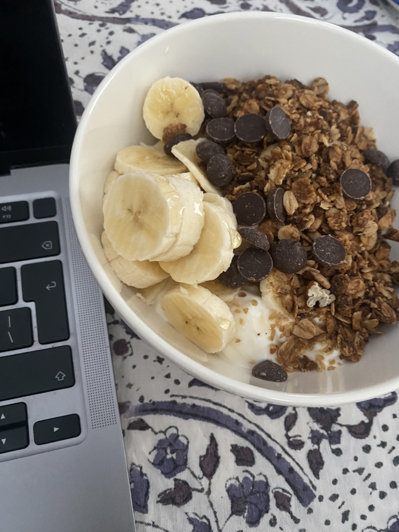 Chocolate granola bowl with banana