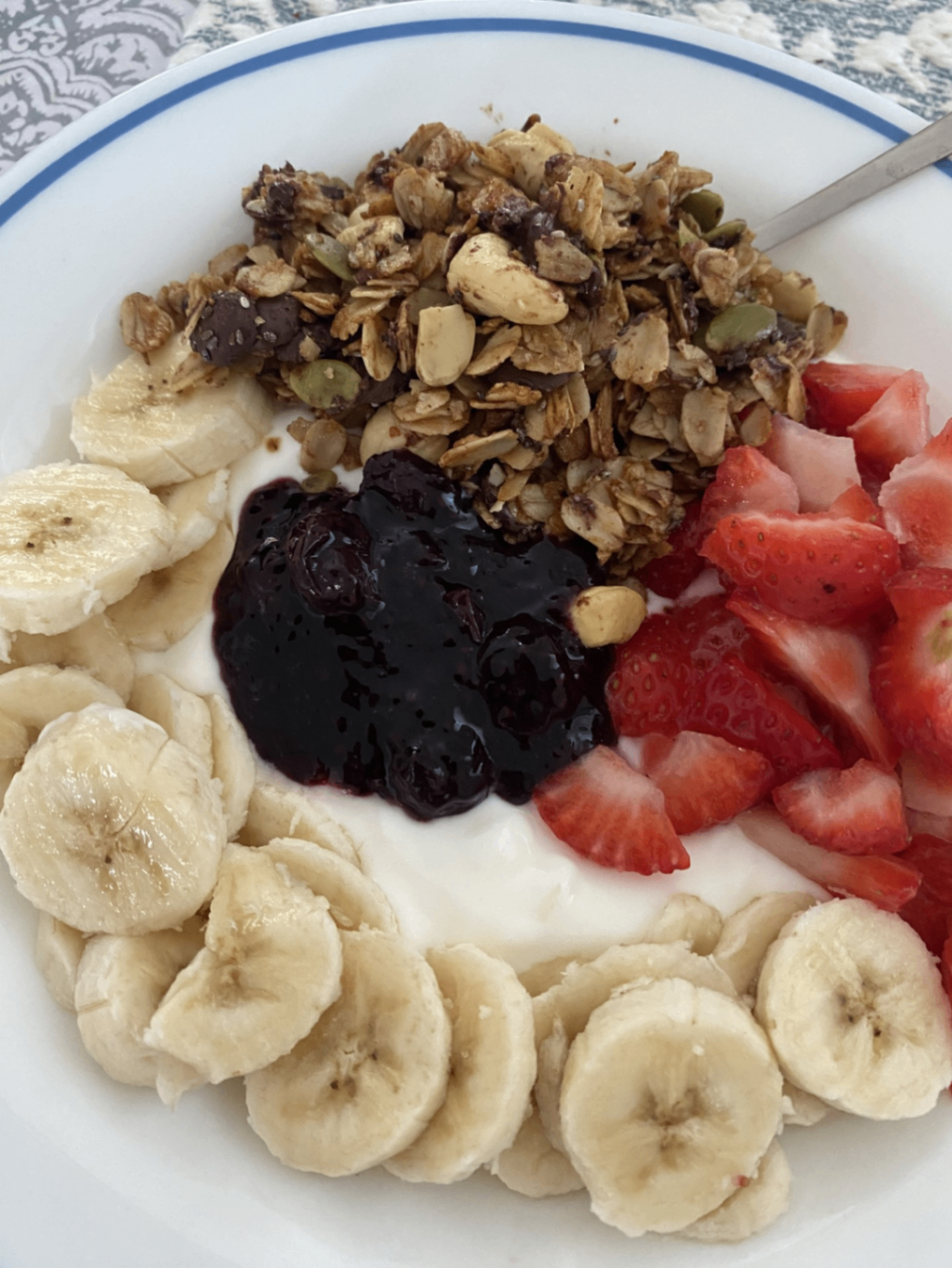 Granola with berry compote and banana
