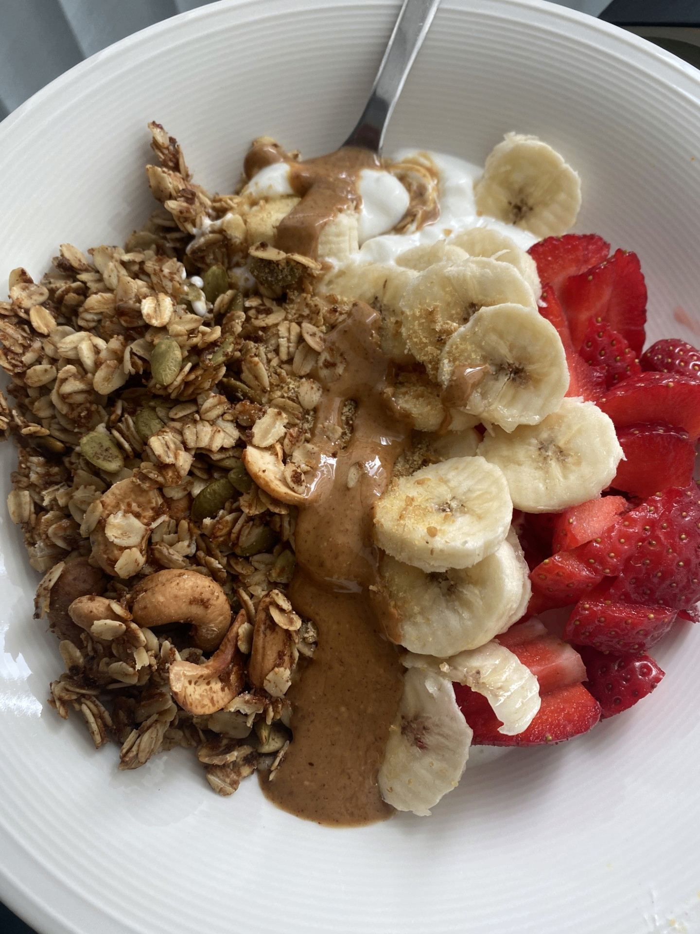 Granola bowl with strawberries and banana